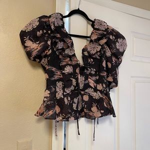 Brand new with tags Top with floral prints short sleeve.